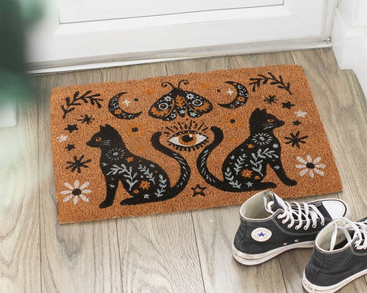 Natural decorative doormat with a gothic folk-inspired design, including black cats, moth, crescent moons and vintage fauna.