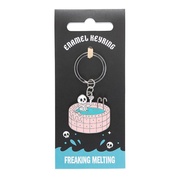 Dead Cool enamel keyring shaped like a skeleton chilling in a pink swimming pool. 