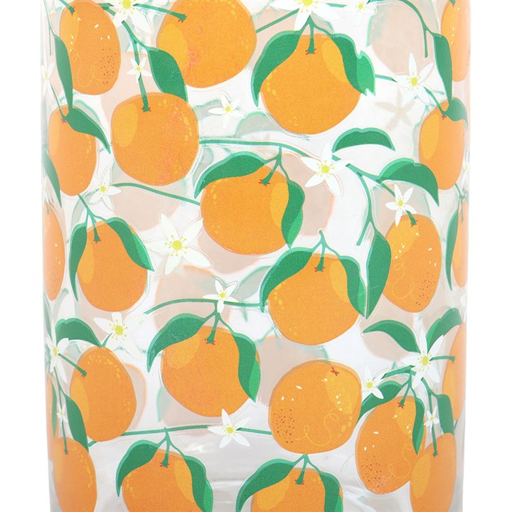 Close up of can-style water glass decorated with orange fruit motif. 