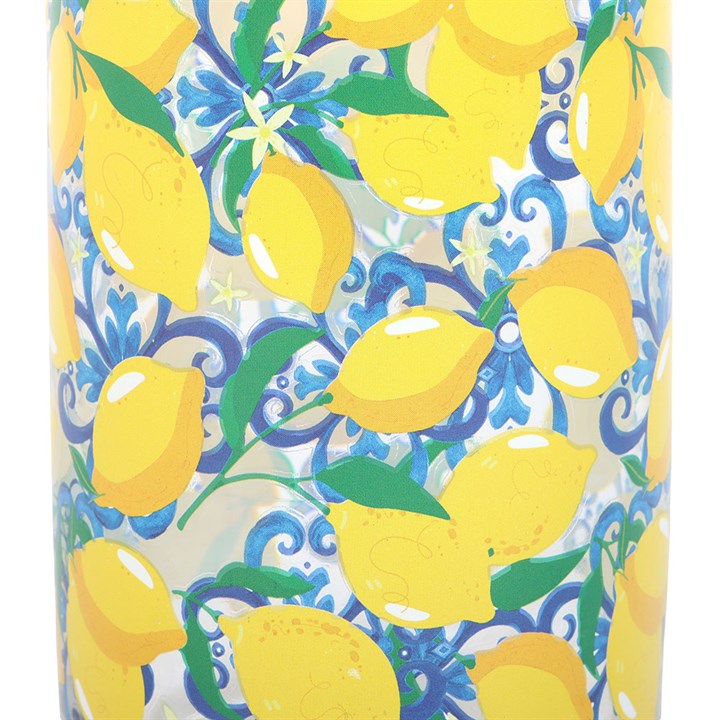 Close up of can-style water glass decorated with lemon fruit motif. 