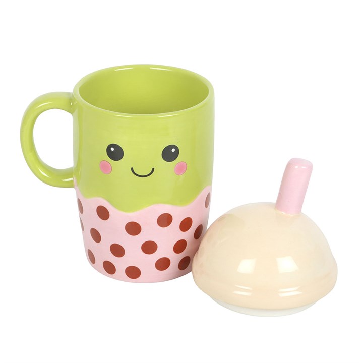Ceramic mug shaped like an adorable Kawaii-inspired boba! Its domed pastel pink lid has a straw and the mug itself has a cute smiley face.