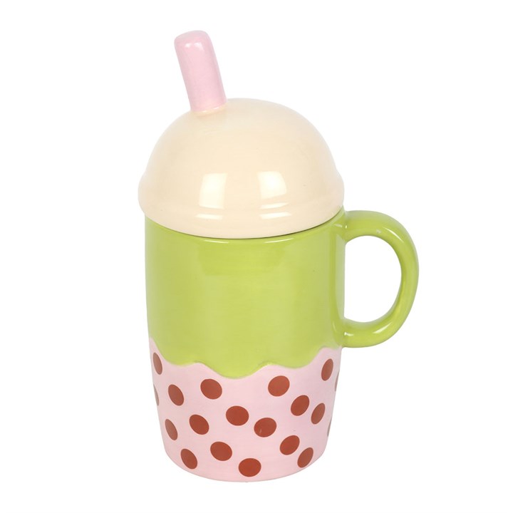 Ceramic mug shaped like an adorable Kawaii-inspired boba! Its domed pastel pink lid has a straw and the mug itself has a cute smiley face. Reverse view.
