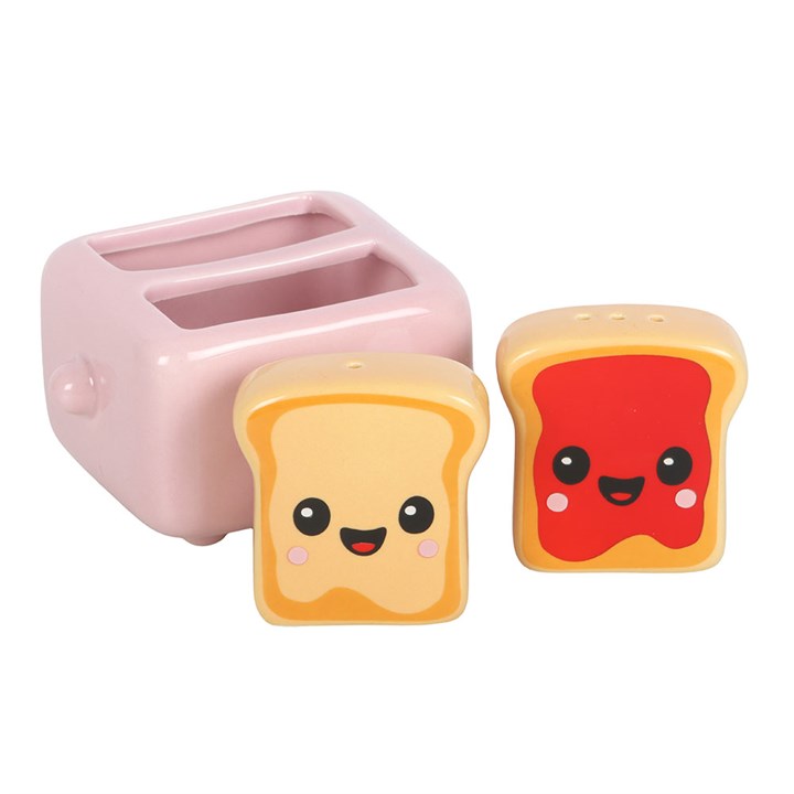 Two kawaii style toast salt and pepper shakers with peanut butter and jam detailing, sold with complementary pink toaster-shaped holder. 