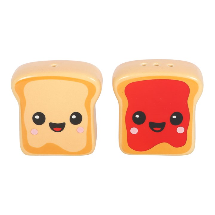 Two kawaii style toast salt and pepper shakers with peanut butter and jam detailing, sold with complementary pink toaster-shaped holder. 