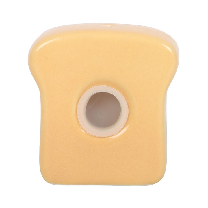 Close up of stopper closing on back of kawaii toast shaped salt shaker.