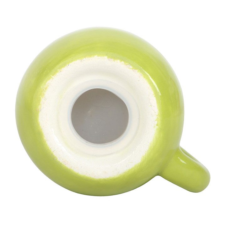 Close up of stopper closing on kawaii matcha mug shaped salt shaker. 