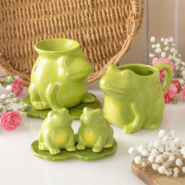 Frog shaped ceramic salt and pepper set on a lily pad tray. Presented alongside other items from the same range. 