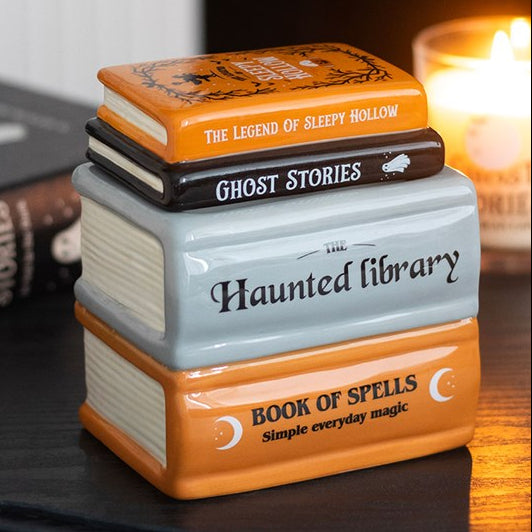 Wax Melter & Oil Burner shaped like a stack of spell books and ghost stories from the Haunted Library range.