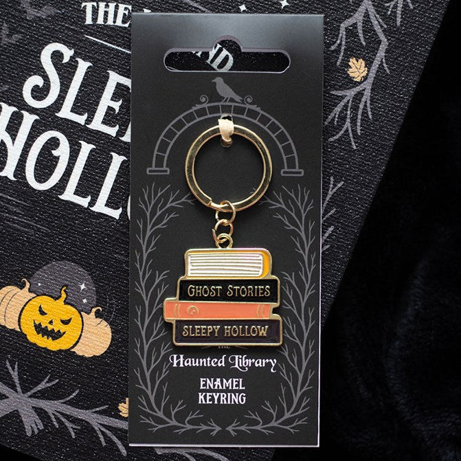 Adorable enamel keychain which is designed like a stack of spell and ghost story books. 