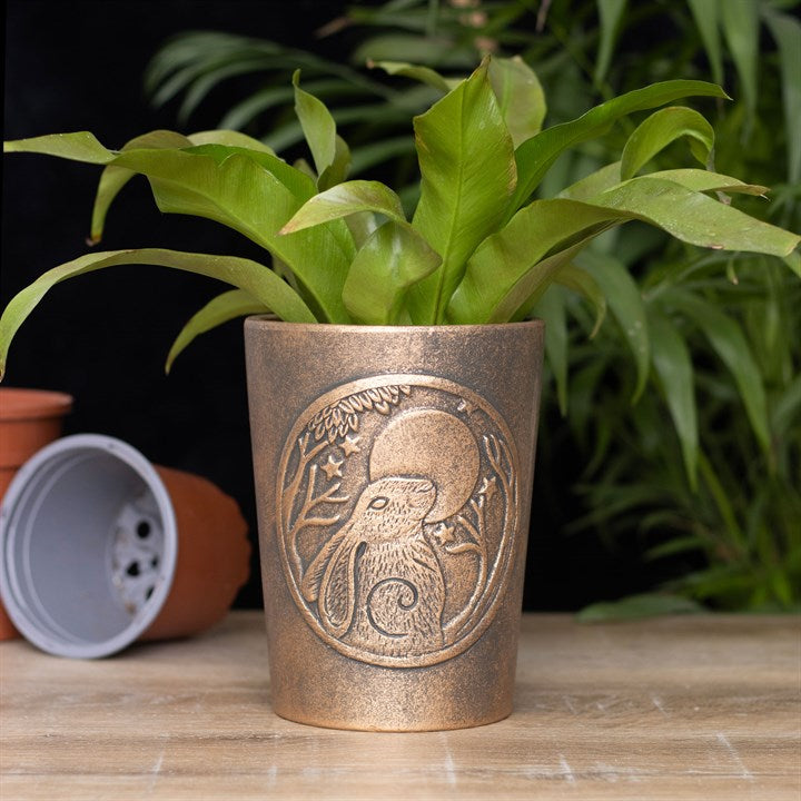 Antique-bronze effect terracotta planter with Moon-Gazing Hares artwork, designed by Lisa Parker.