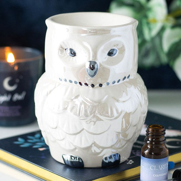 Ceramic iridescent owl shaped wax melter and oil burner. 