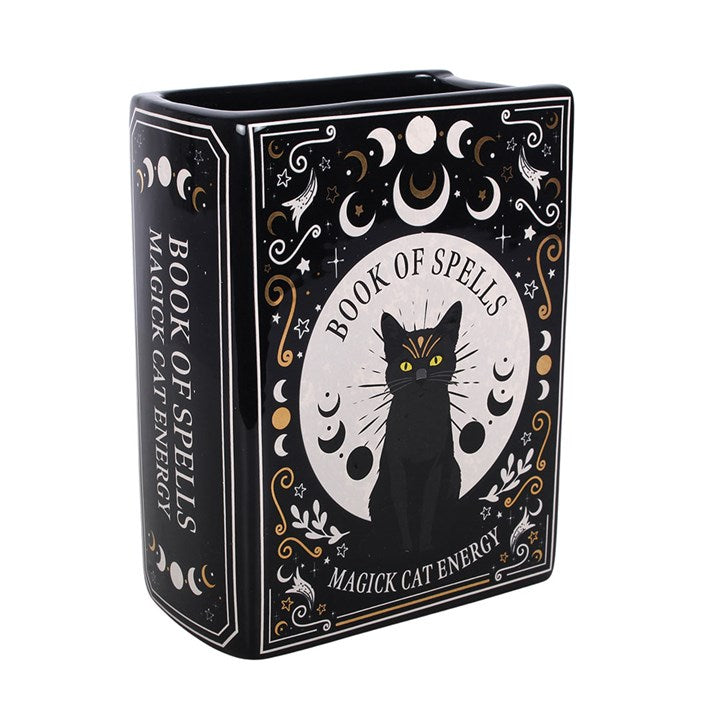 Black book shaped vase with gothic-inspired black cat celestial design and 'Book of Spells I Magick Cat Energy' text.
