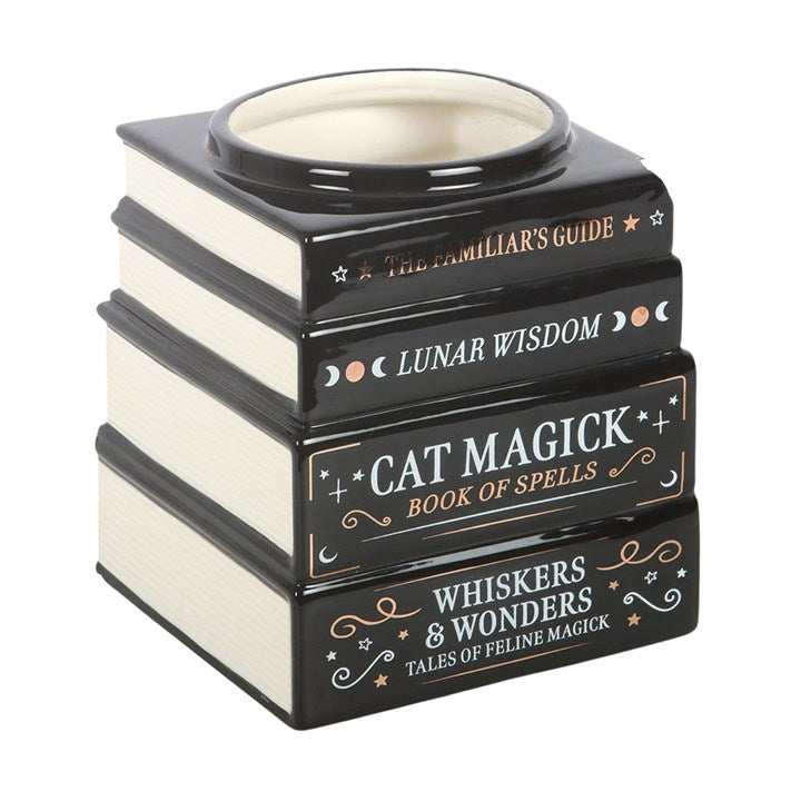 A black gothic themed flower vase, resembling a stack of spell and celestial books.