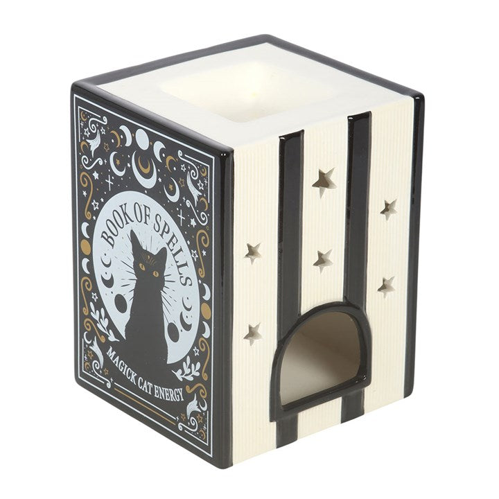 Ceramic wax melter and oil burner shaped like a trio of black cat-inspired spell books.  Reverse view.
