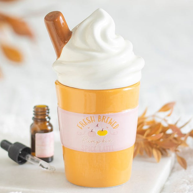 Spiced latte shaped wax melter and oil burner with a whipped cream shaped lid and cinnamon stick detailing.