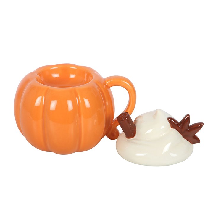 Ceramic wax melter and oil burner shaped like a pumpkin-shaped mug with a whipped cream and cinnamon shaped lid.