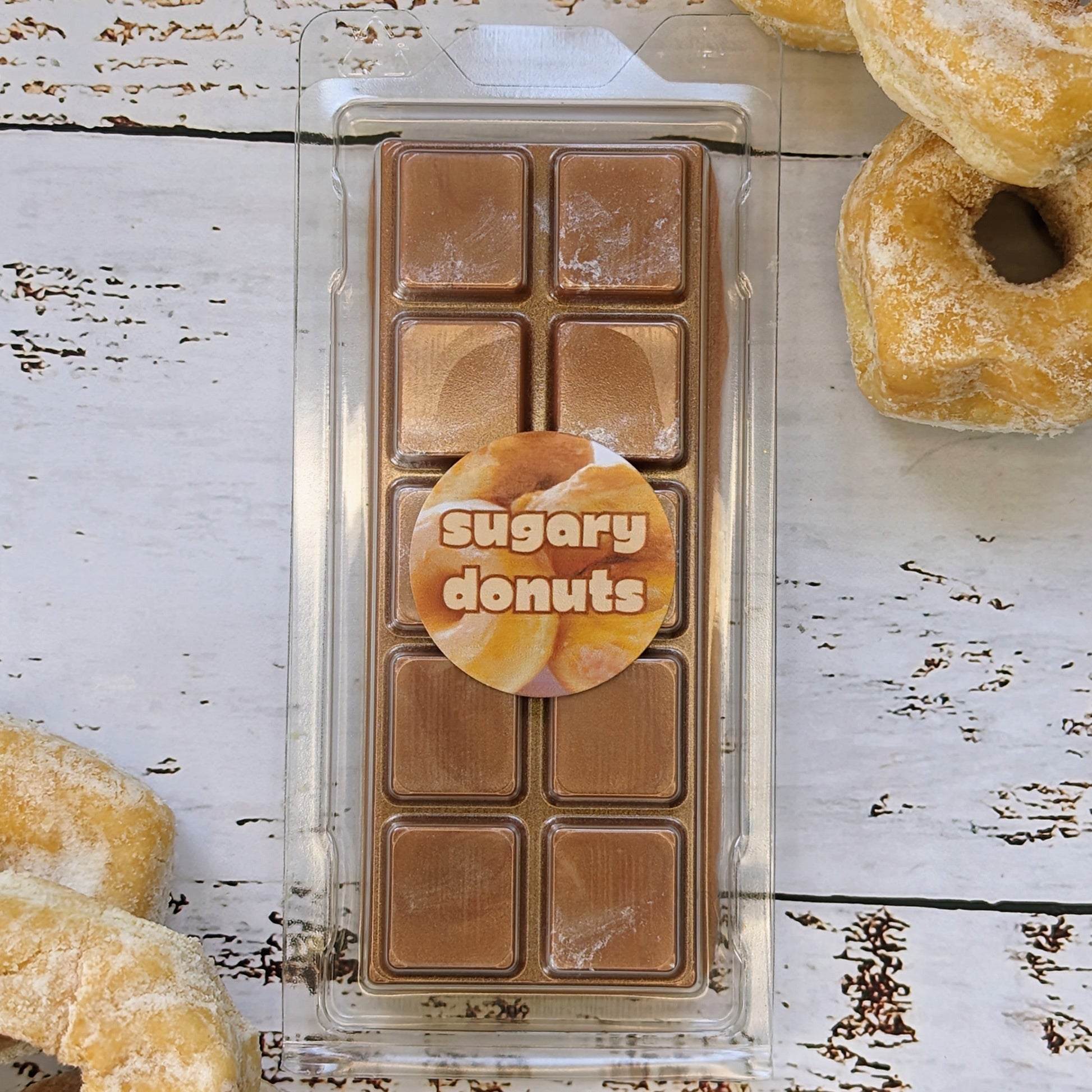 Sugary donuts coconut wax melt. Light brown snap bar with silver shimmery accents.