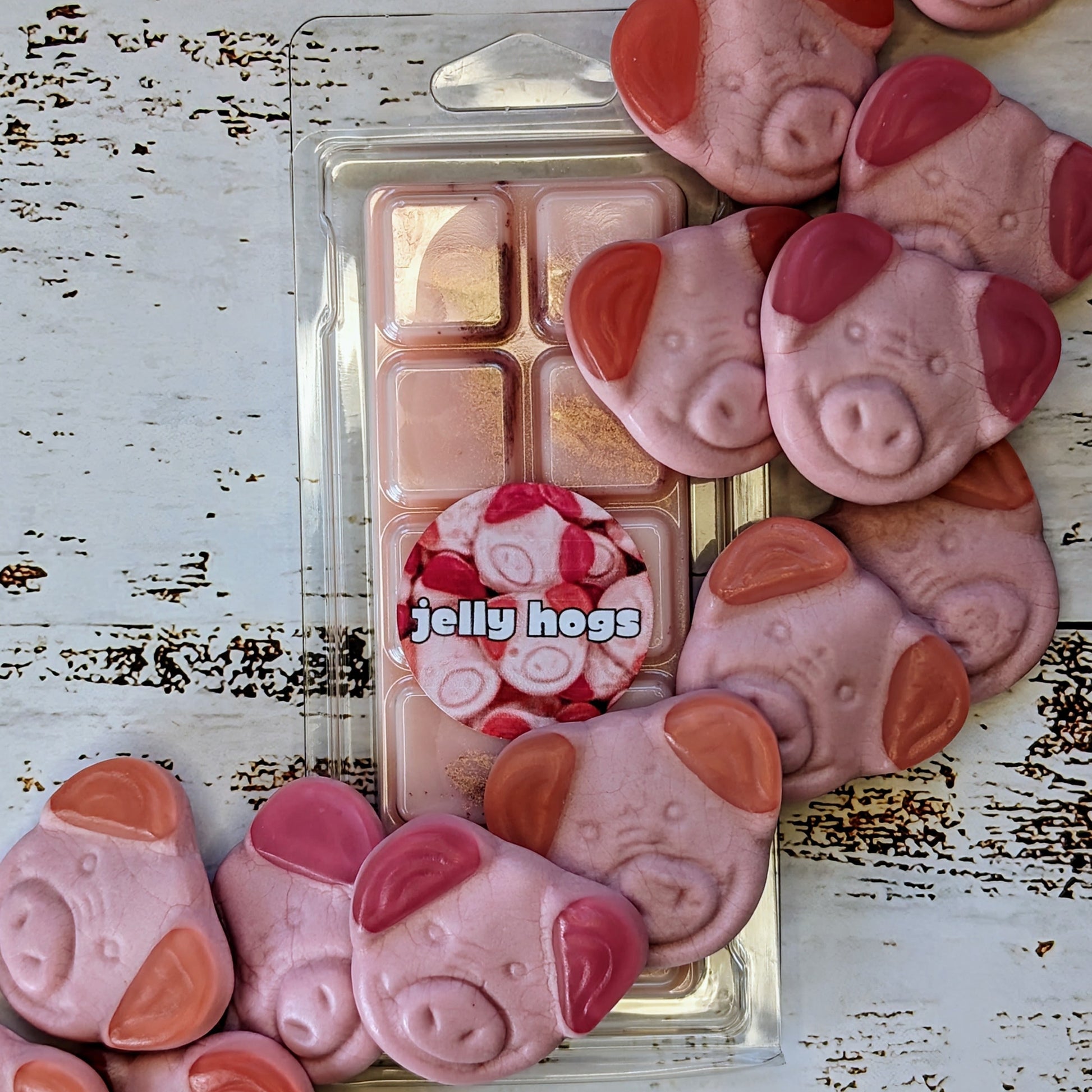 Jelly Hog coconut wax melt. Light pink snap bar with golden shimmer accents. 