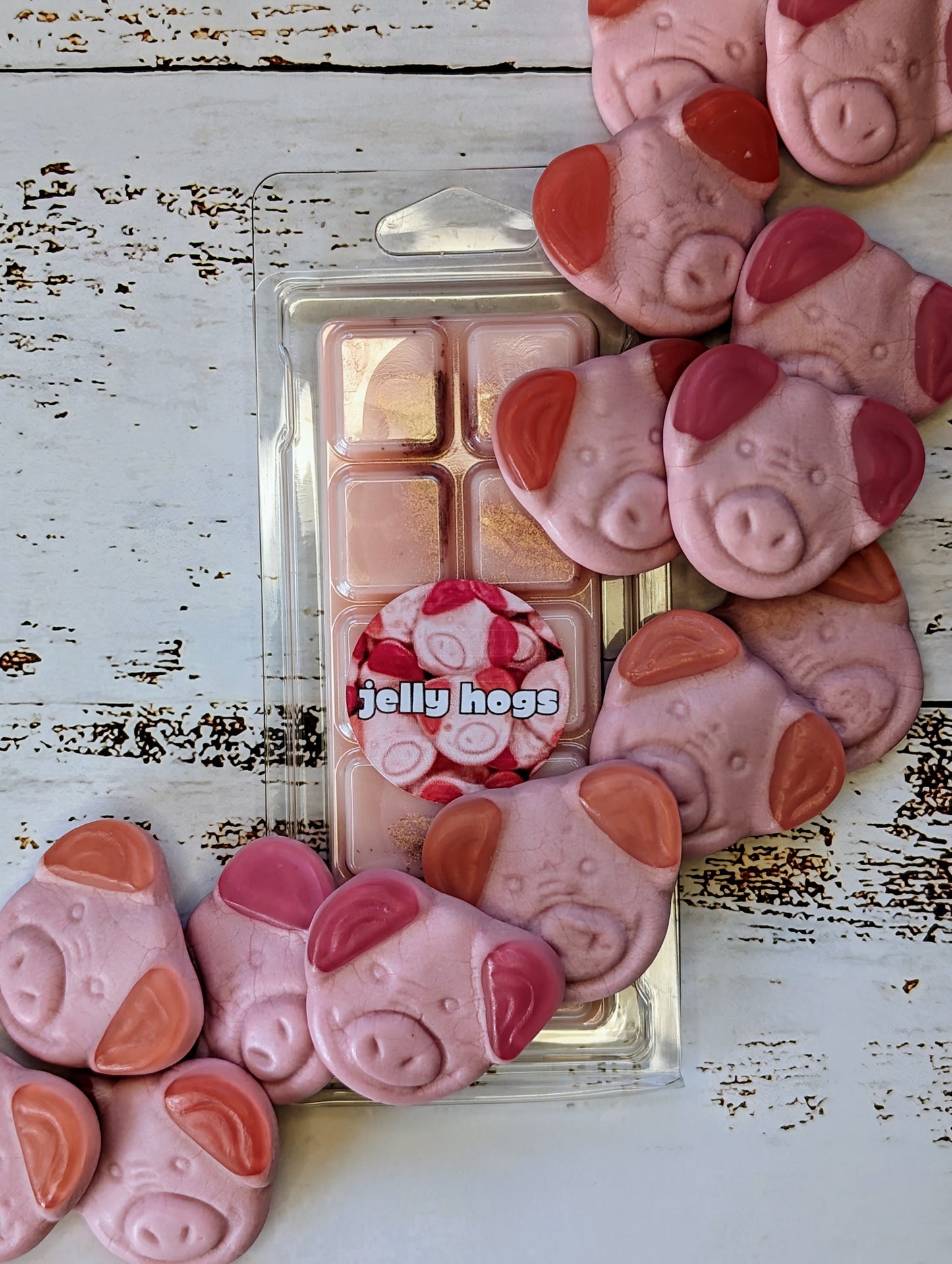 Jelly Hog coconut wax melt. Light pink snap bar with golden shimmer accents. 