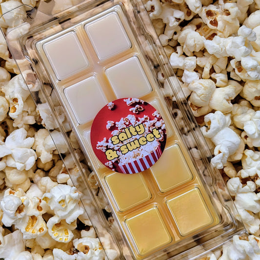 Salty and sweet popcorn coconut wax melt. Light and dark yellow ombre snap bar with orange shimmer accents. 