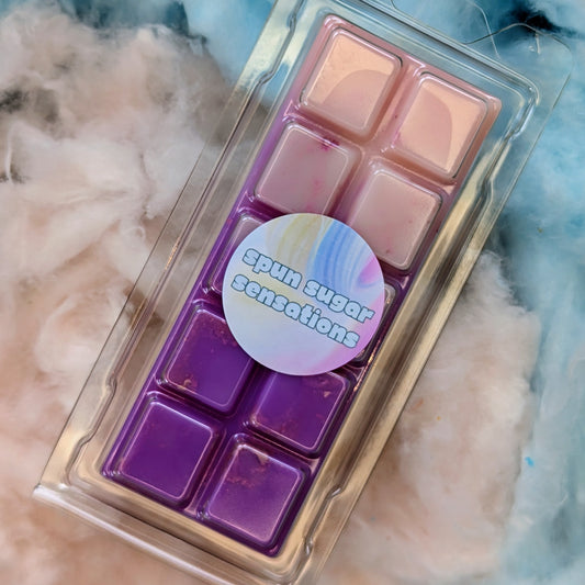 Spun Sugar Sensations coconut wax melt. Light pink and purple ombre snap bar with silver shimmer accents.