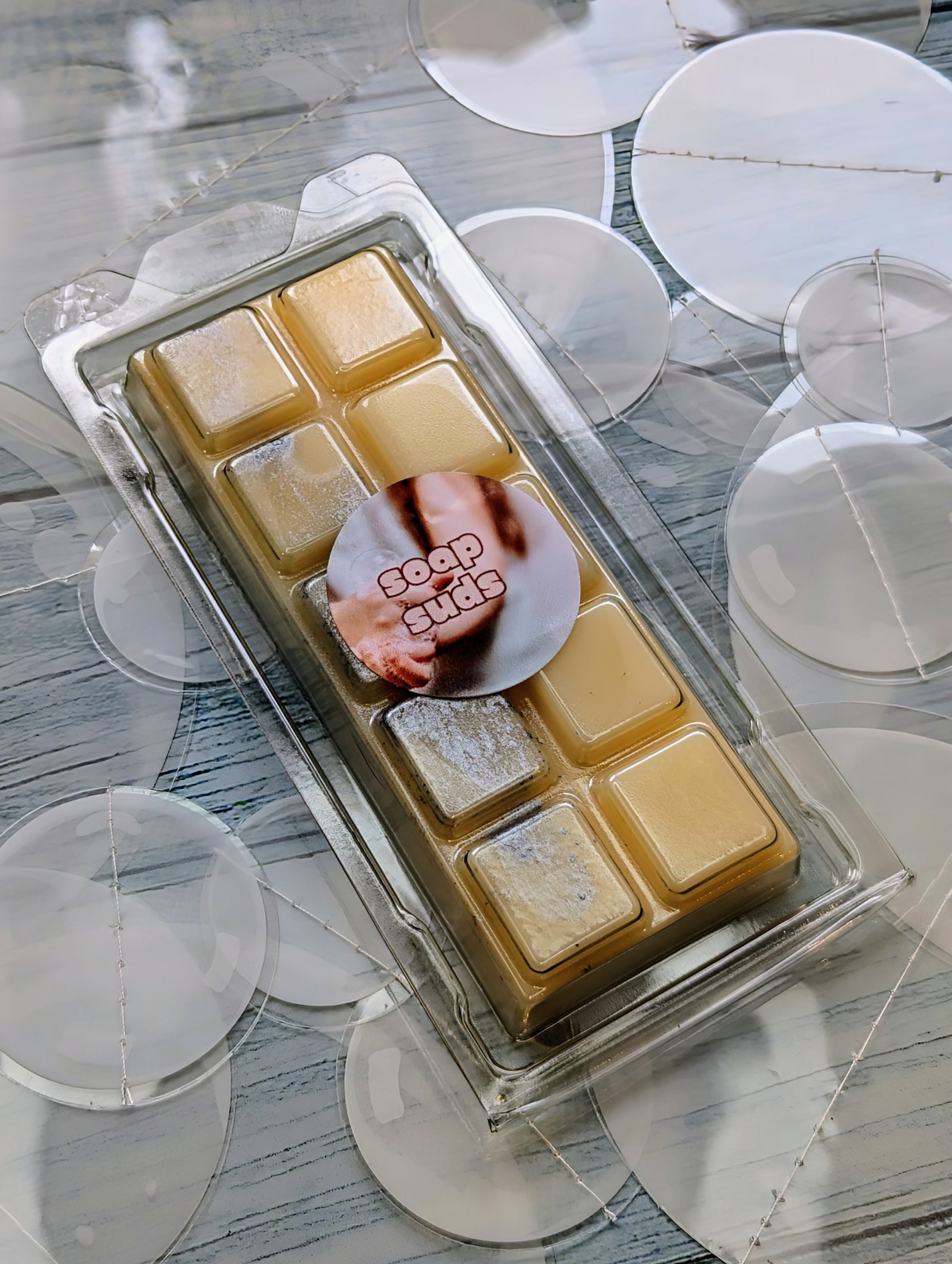 Soap Suds coconut wax melt. Beige snap bar with silver shimmer accents. 