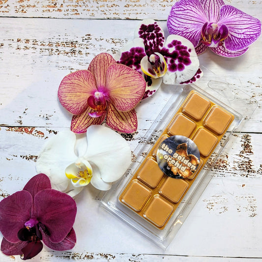 The Golden Orchid coconut wax melt. Gold snap bar with golden shimmer accents.
