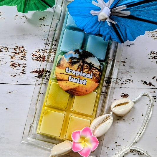 Tropical Twist coconut wax melt. Light blue and yellow ombre snap bar with yellow shimmer accents. 