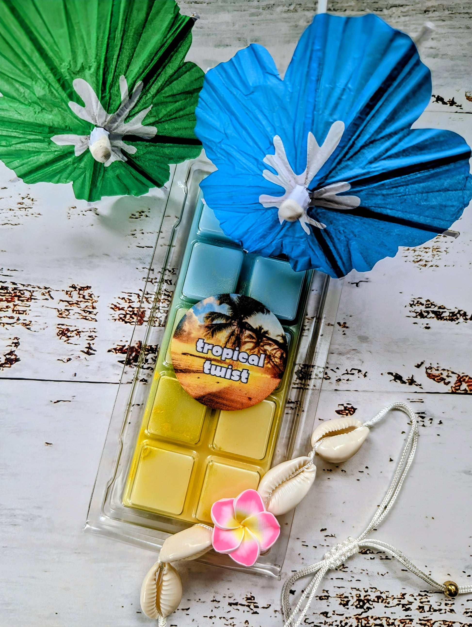 Tropical Twist coconut wax melt. Light blue and yellow ombre snap bar with yellow shimmer accents. 