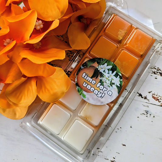 Time for a Vacay! coconut wax melt. Orange and cream ombre snap bar with gold shimmer accents. 