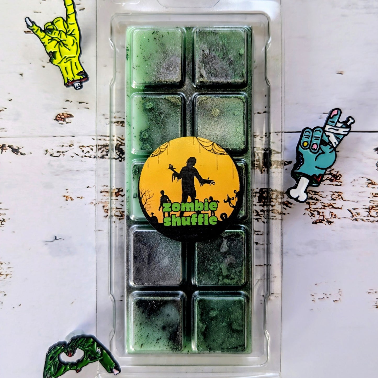 Zombie Shuffle coconut wax melt. Deep green snap bar with emerald and dark green shimmer accents. 