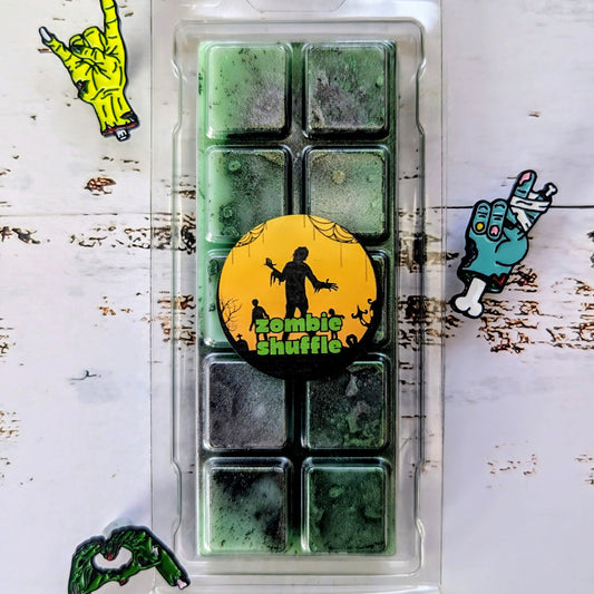 Zombie Shuffle coconut wax melt. Deep green snap bar with emerald and dark green shimmer accents. 