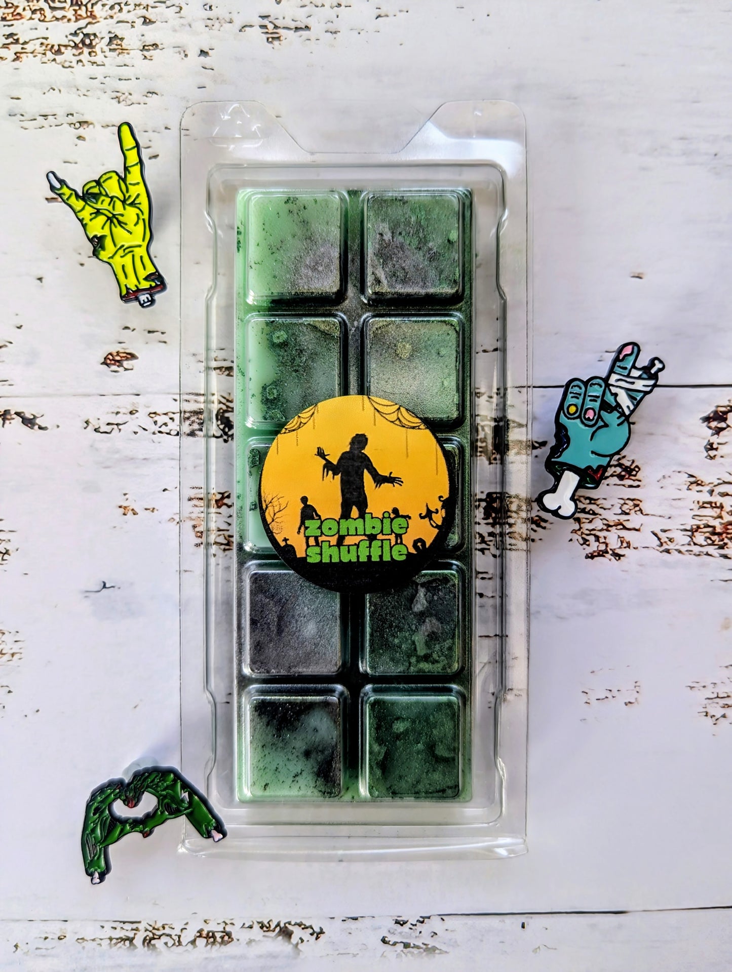 Zombie Shuffle coconut wax melt. Deep green snap bar with emerald and dark green shimmer accents. 
