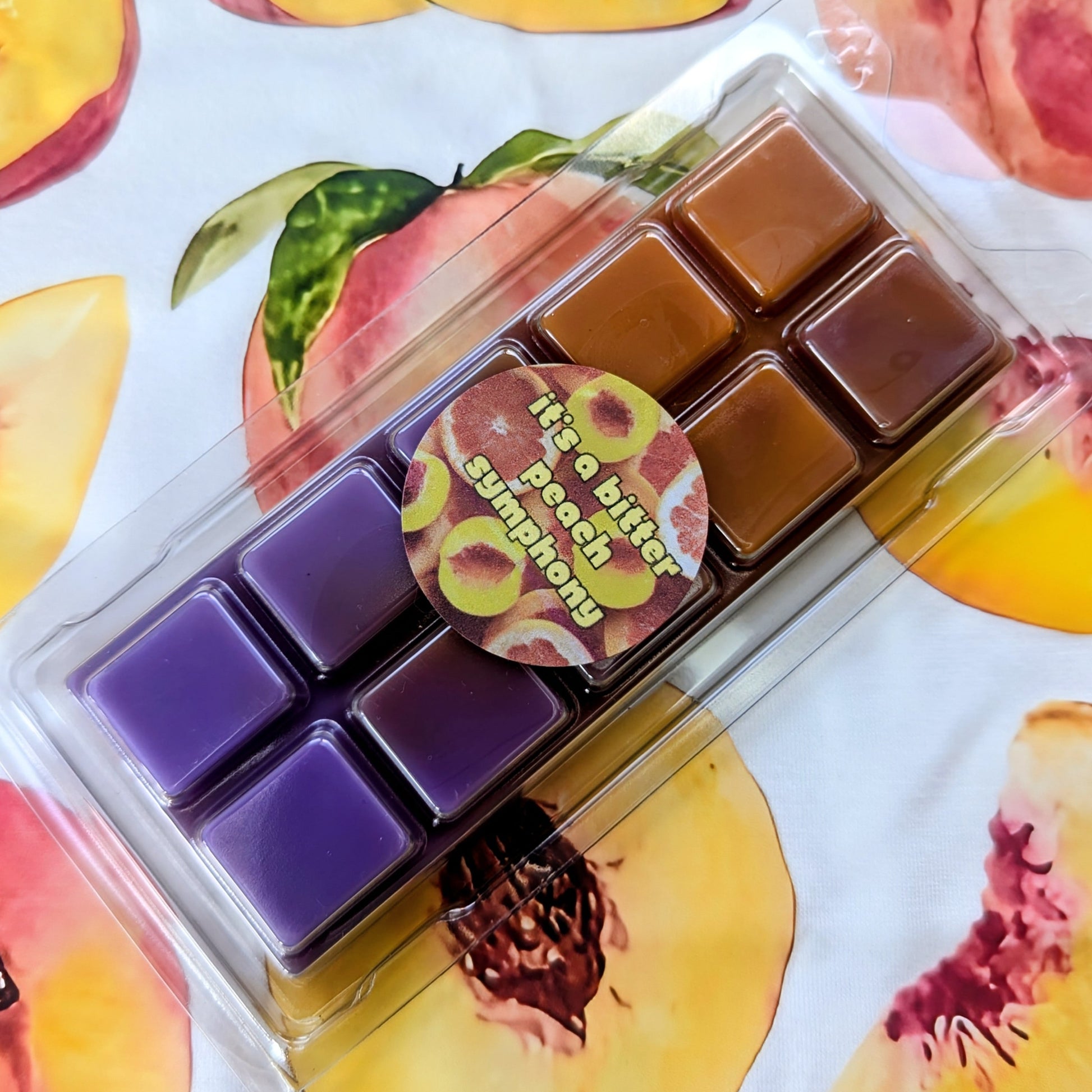 It's A Bitter Peach Symphony coconut wax melt. Orange and purple ombre snap bar. 