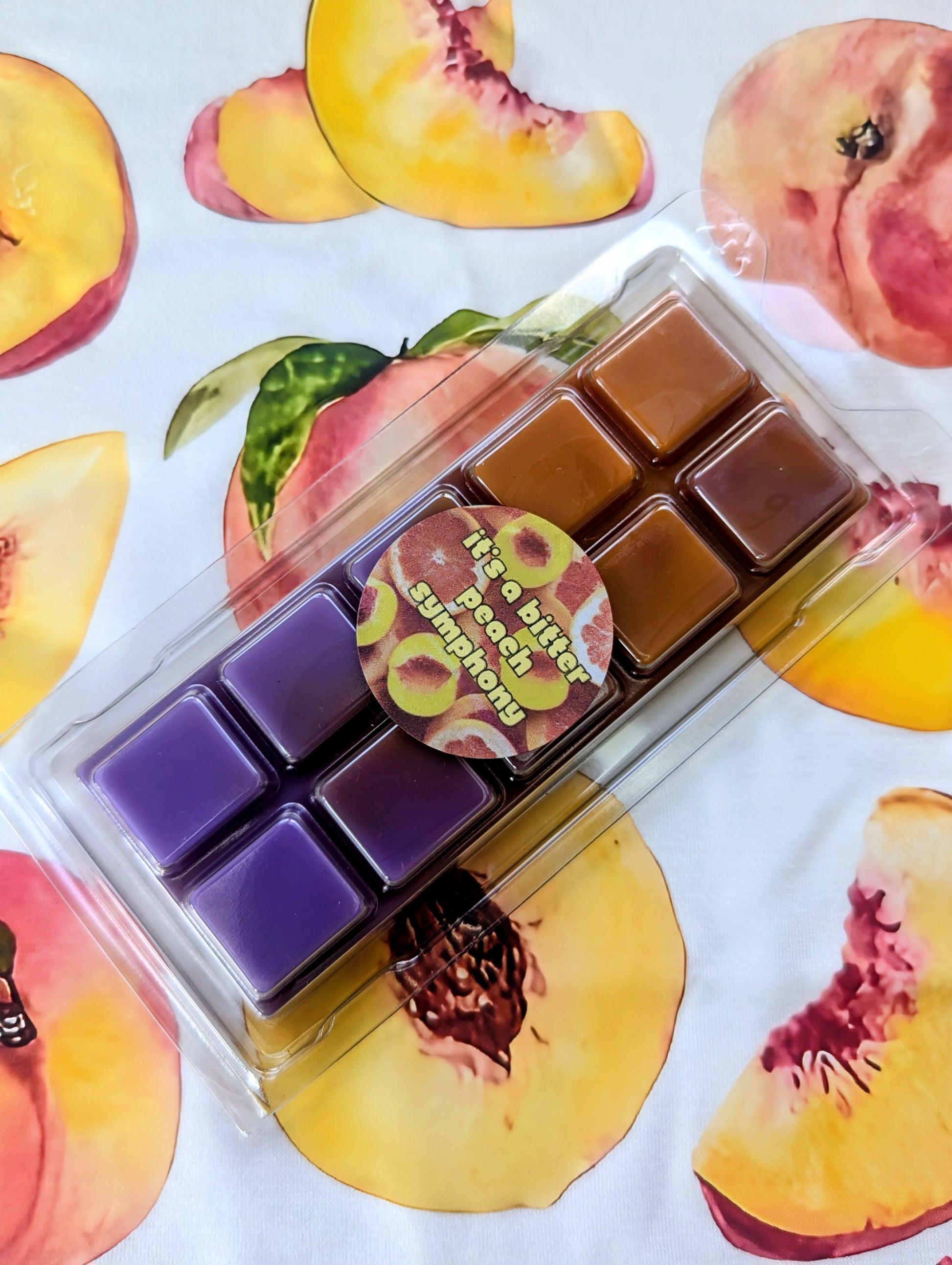 It's A Bitter Peach Symphony coconut wax melt. Orange and purple ombre snap bar. 