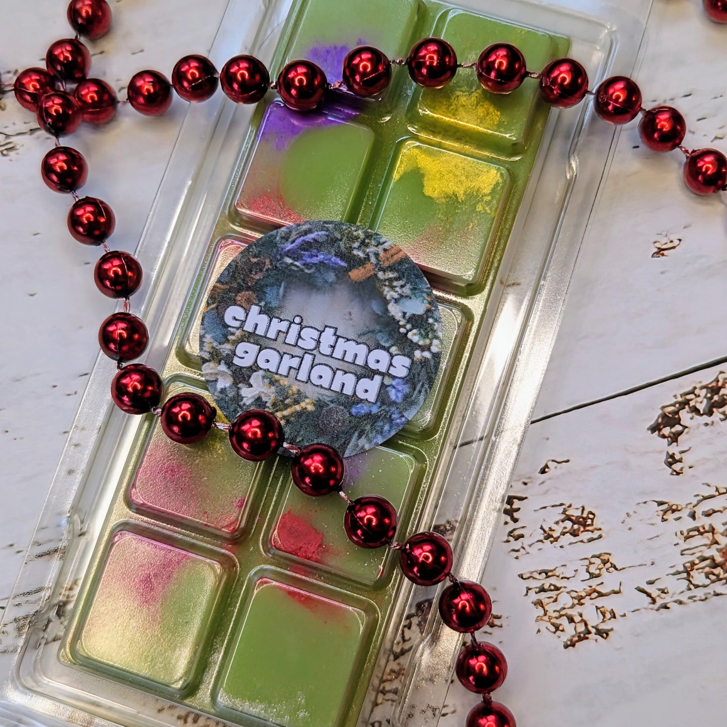 Christmas Garland coconut wax melt. Tree  green snap bar with yellow, purple and red shimmer accents. 
