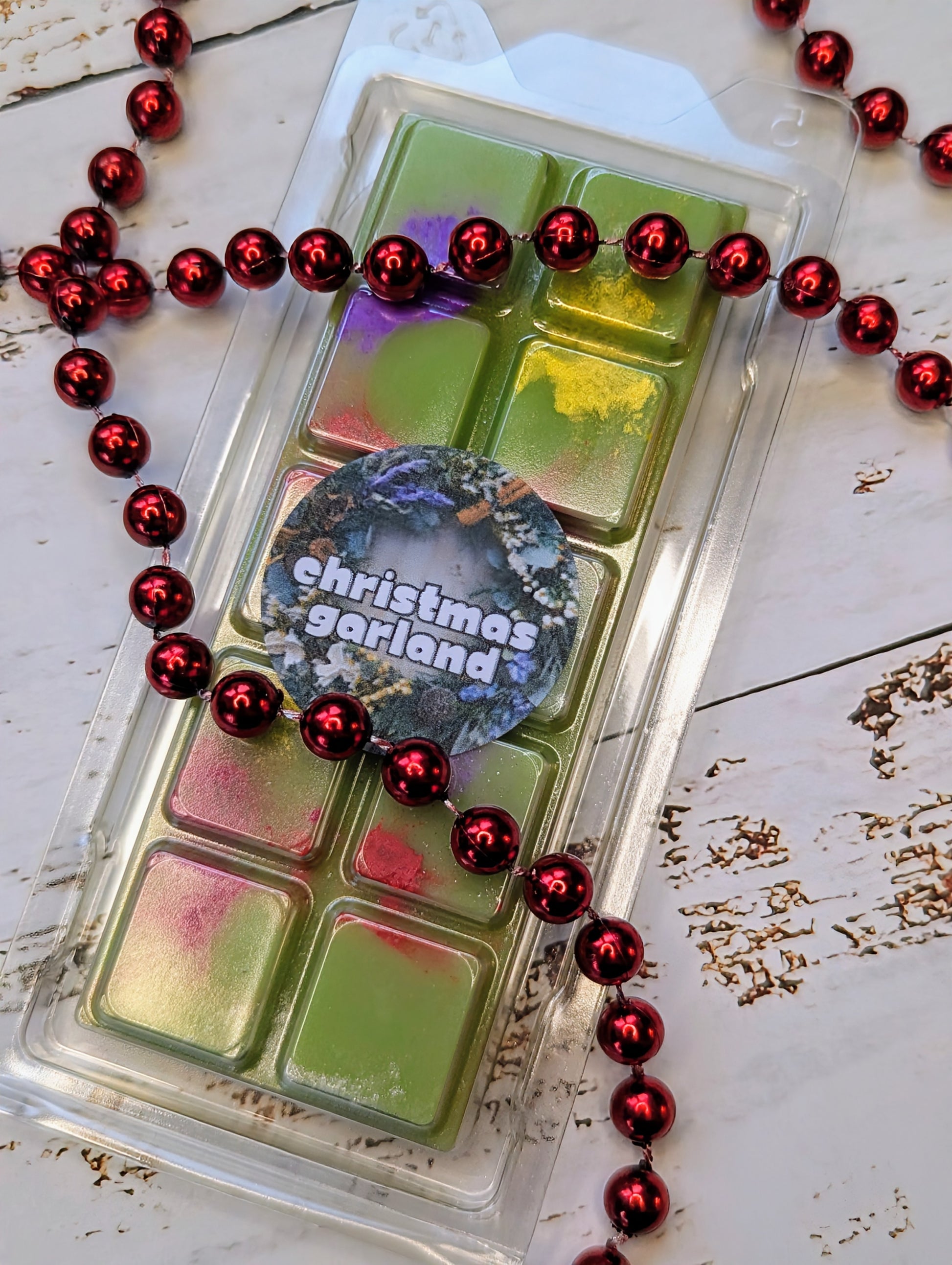 Christmas Garland coconut wax melt. Tree  green snap bar with yellow, purple and red shimmer accents. 