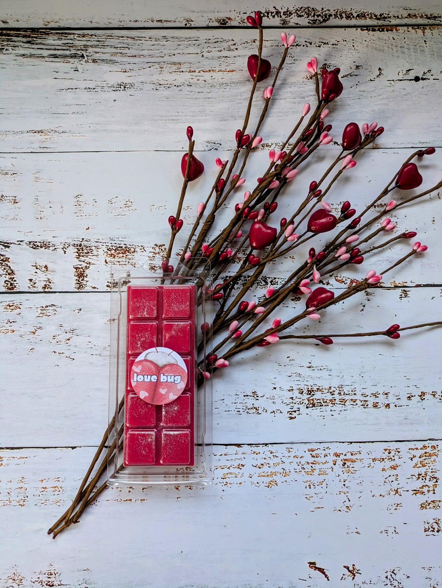 Love Bug coconut wax melt. Deep pink snap bar with silver shimmer accents.
