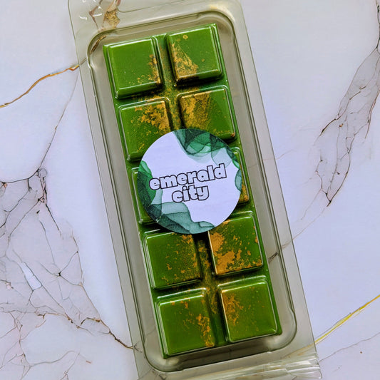 Emerald City coconut wax melt. Olive green snap bar with gold shimmer accents.