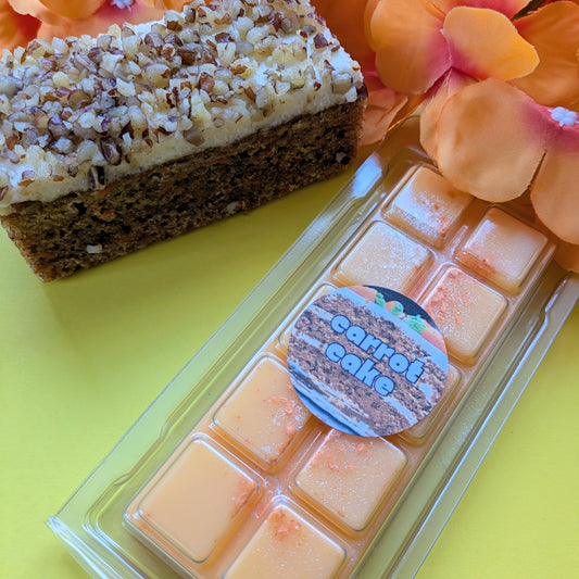 Carrot Cake coconut wax melt. Light orange snap bar with dark orange and gold shimmer accents. 
