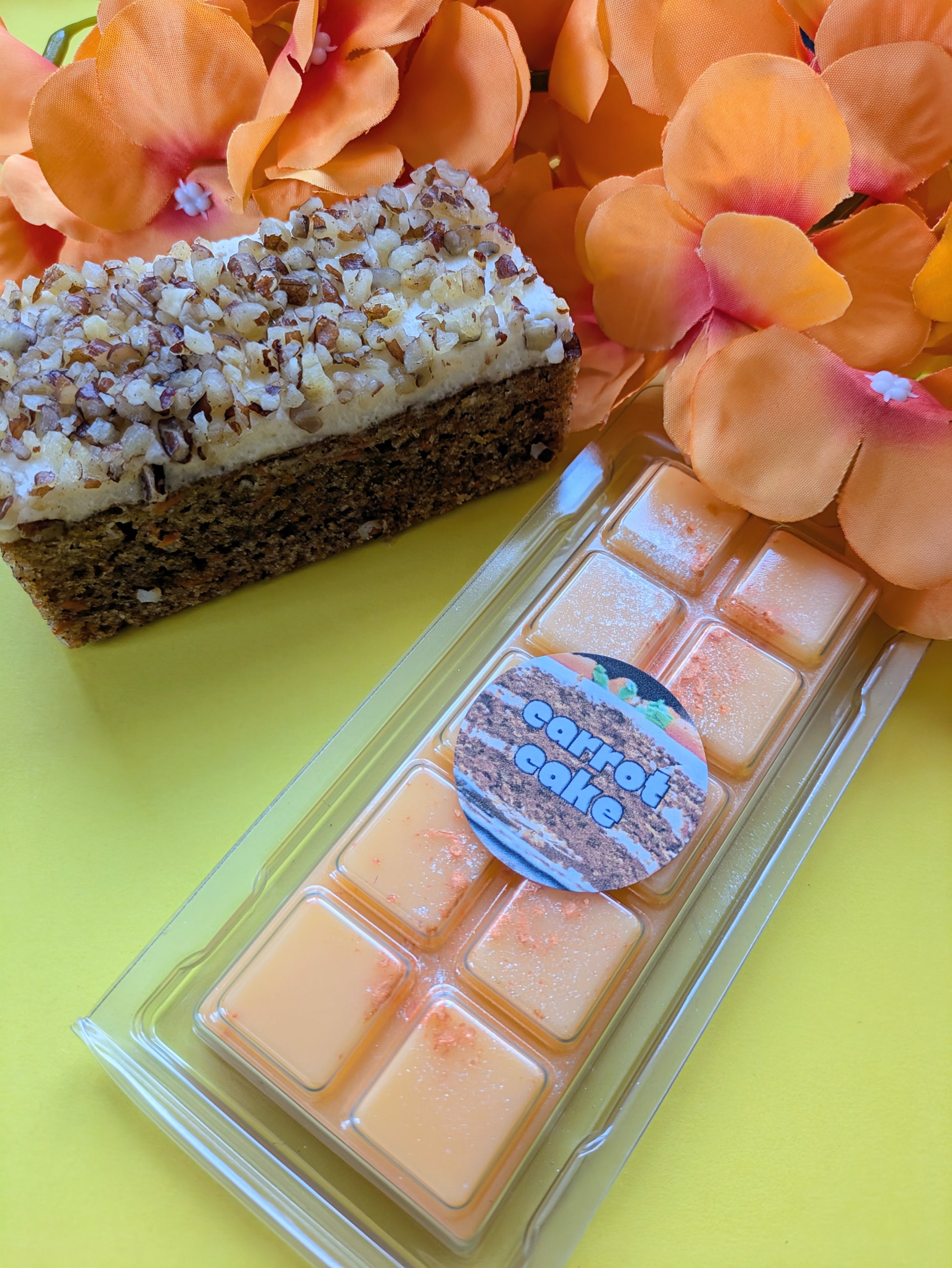 Carrot Cake coconut wax melt. Light orange snap bar with dark orange and gold shimmer accents. 