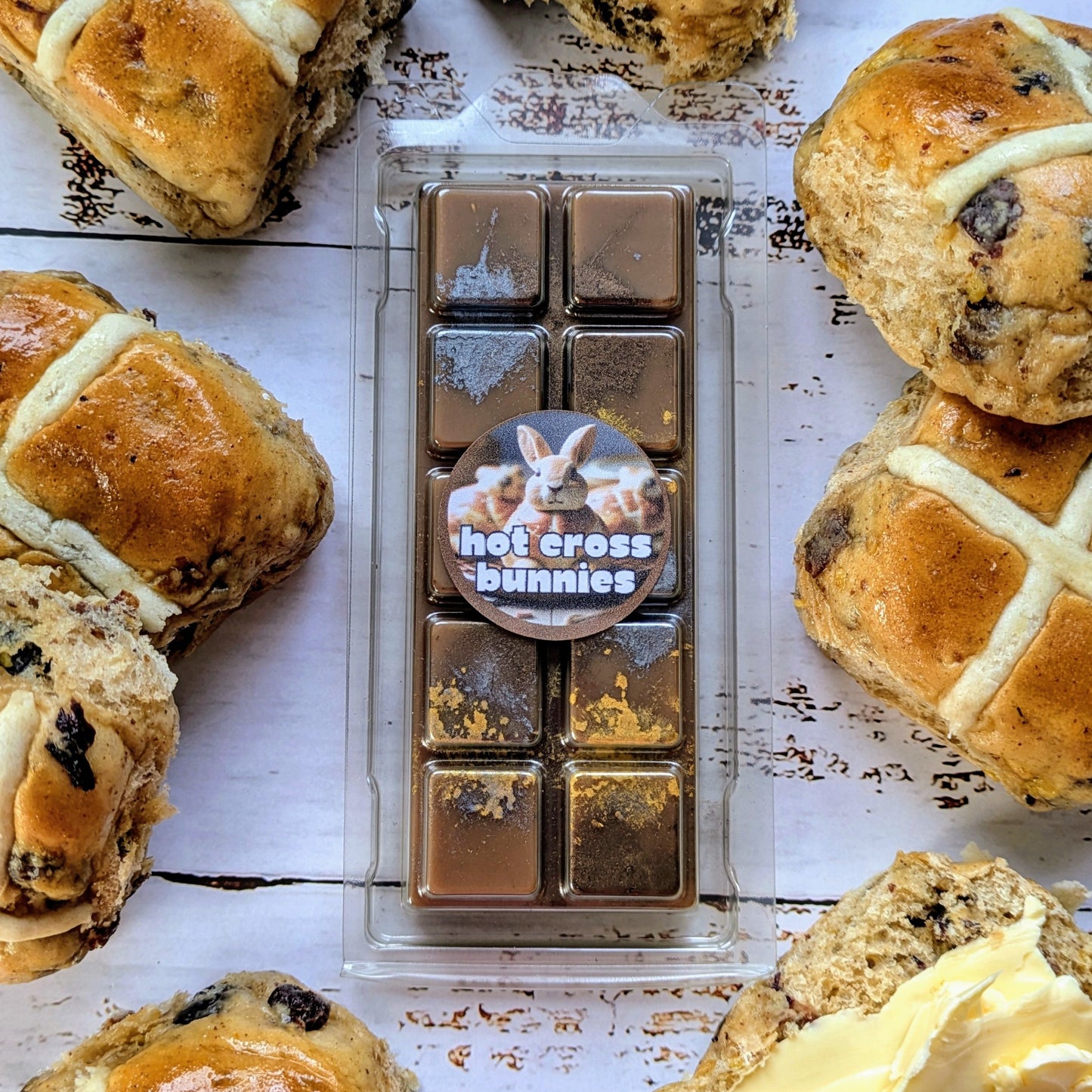 Hot Cross Bunnies coconut wax melt. Dark brown snap bar with gold and metallic silver shimmer accents. 
