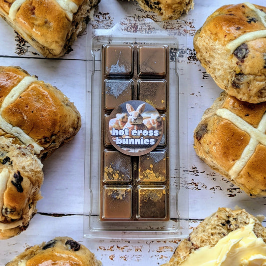 Hot Cross Bunnies coconut wax melt. Dark brown snap bar with gold and metallic silver shimmer accents. 