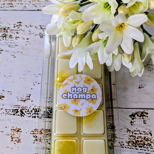 Nag Champa coconut wax melt. White snap bar with yellow and gold shimmer accents.