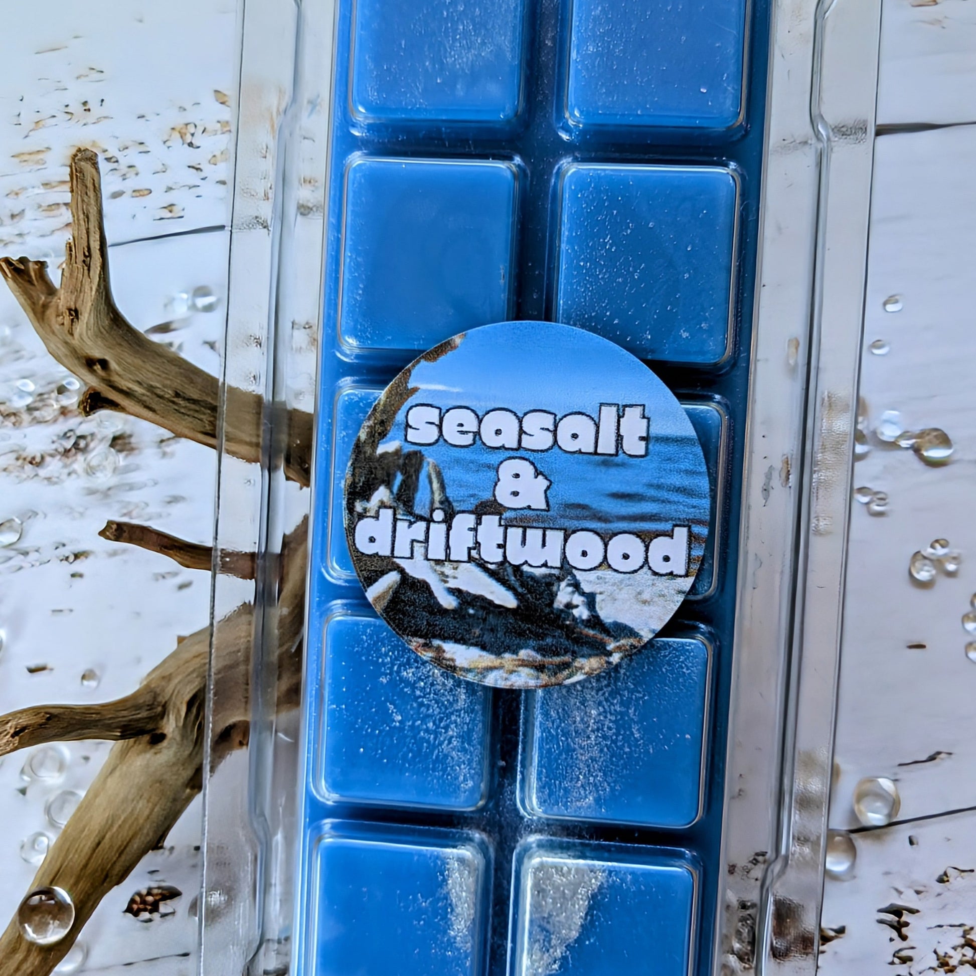 Seasalt and Driftwood coconut wax melt. Deep blue snap bar with silver shimmer accents.