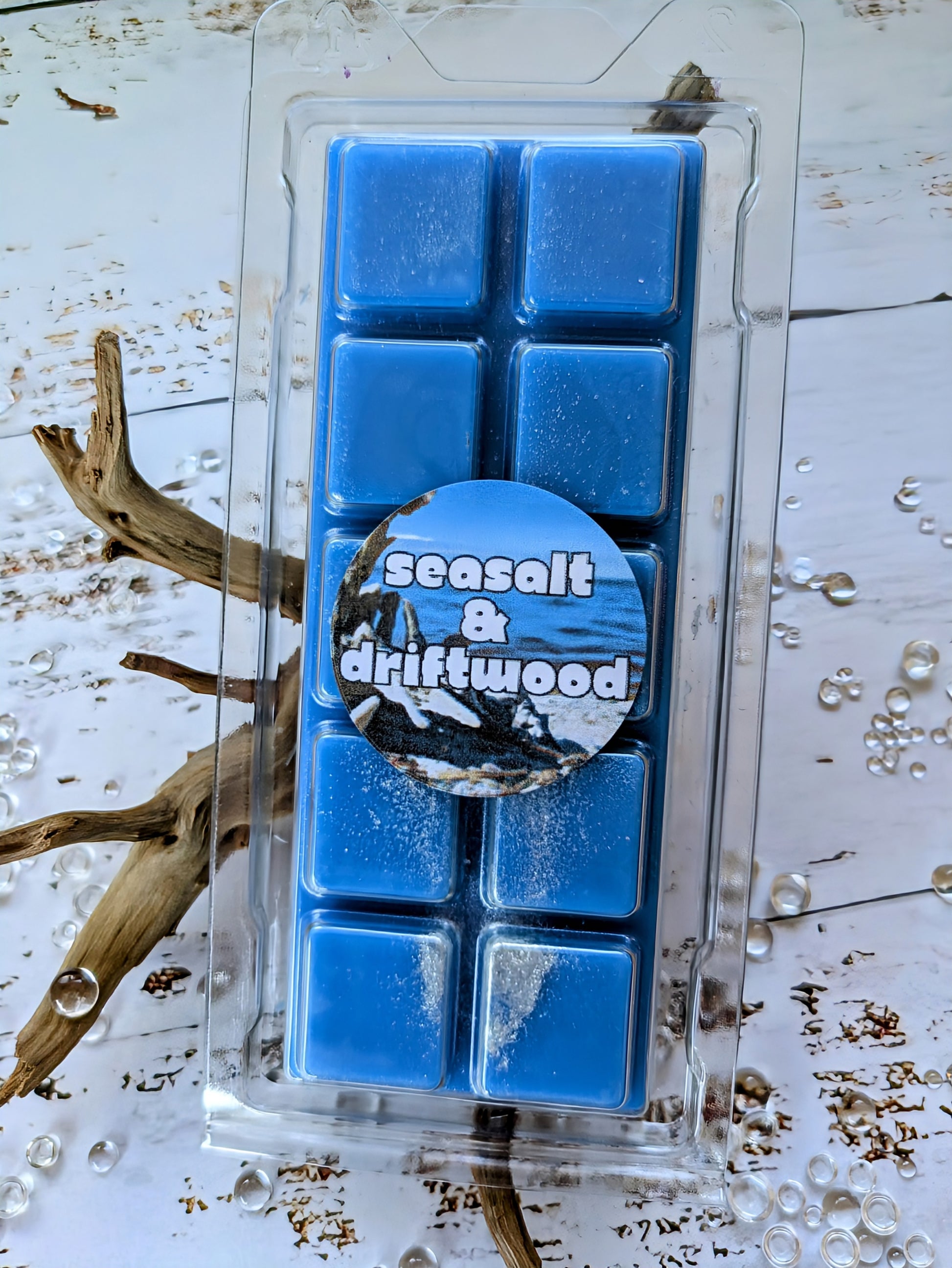 Seasalt and Driftwood coconut wax melt. Deep blue snap bar with silver shimmer accents.