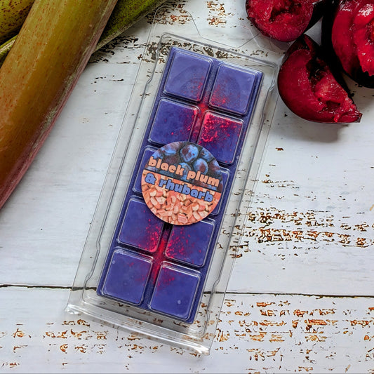 Black Plum and Rhubarb coconut wax melt. Deep purple snap bar with fluorescent pink shimmer accents.