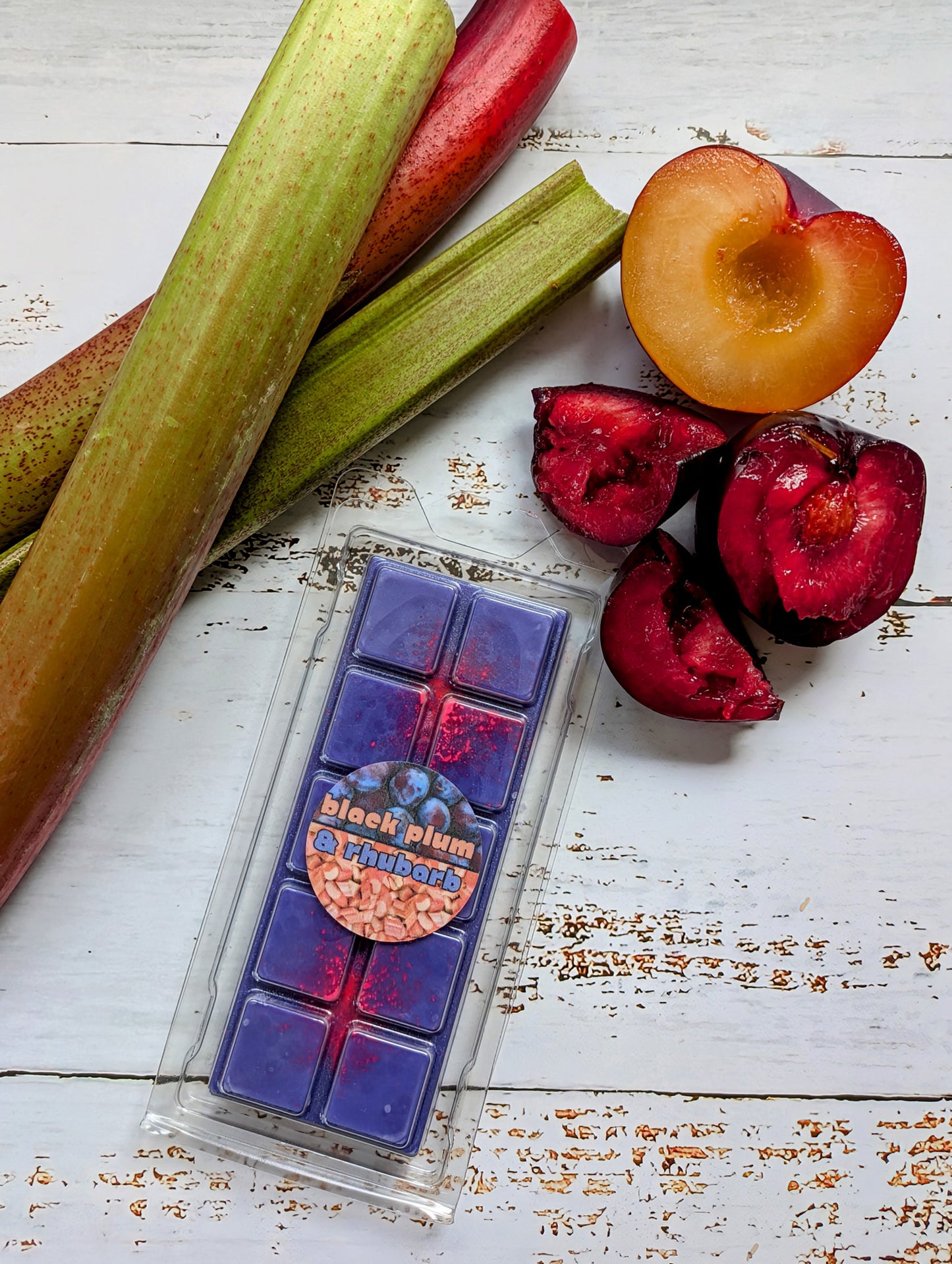 Black Plum and Rhubarb coconut wax melt. Deep purple snap bar with fluorescent pink shimmer accents.