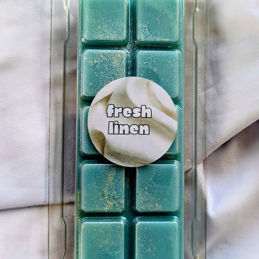Fresh Linen coconut wax melt. Teal snap bar with silver and white shimmer accents