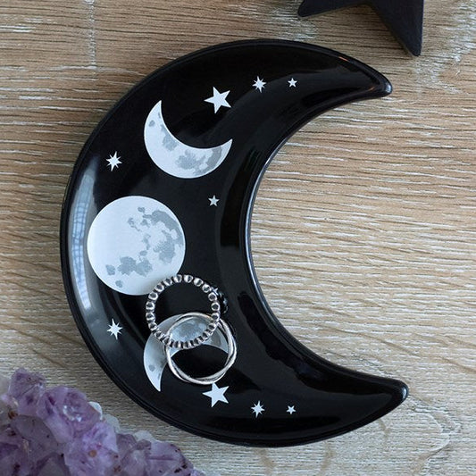 Black crescent moon shaped trinket dish, finished with a contemporary silver moon-phase design. 